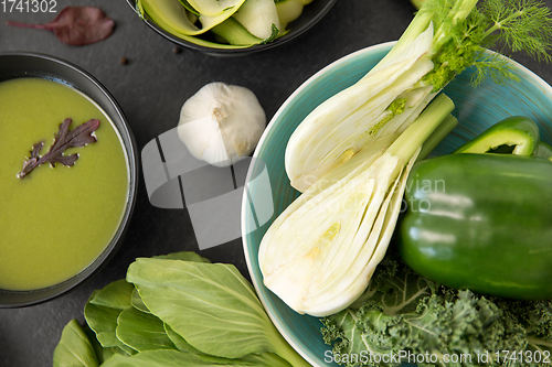 Image of green vegetables and cream soup in ceramic bowl