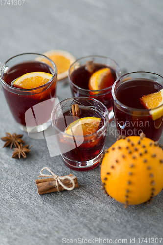 Image of glasses of mulled wine with orange and cinnamon