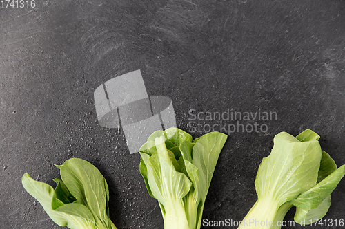 Image of close up of bok choy cabbage on slate background