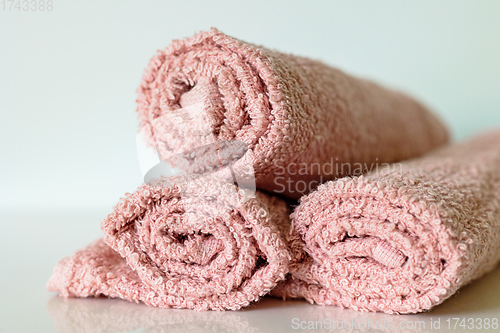 Image of pink bath towel rolls