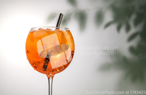 Image of glass of orange cocktail