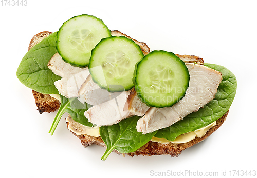 Image of slice of bread with chicken meat and cucumbers