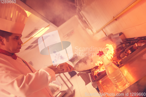 Image of Chef doing flambe on food