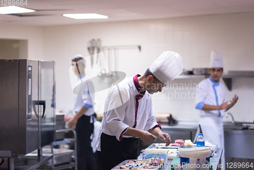 Image of team cooks and chefs preparing meals