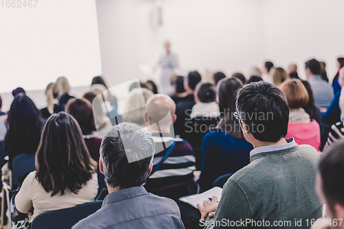 Image of Woman giving presentation on business conference.