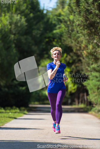 Image of young female runner training for marathon