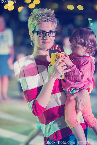 Image of mother and little daughter in the kids disco