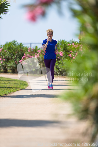 Image of young female runner training for marathon