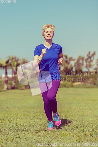 Image of young female runner training for marathon