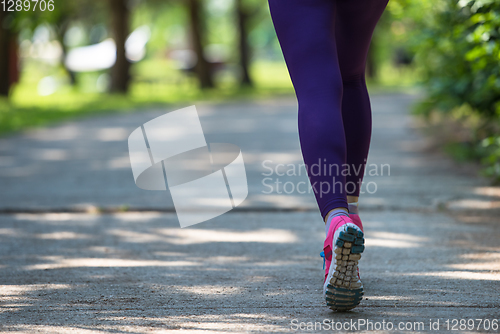Image of young female runner training for marathon