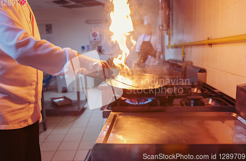 Image of Chef doing flambe on food