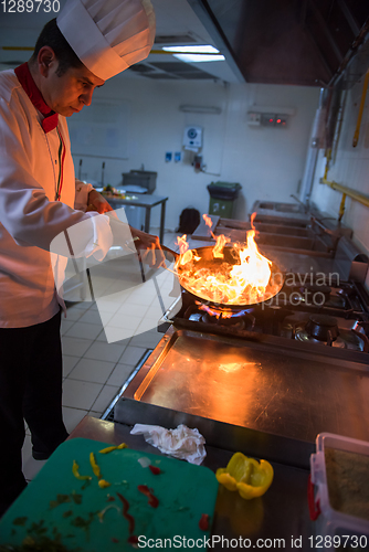 Image of Chef doing flambe on food