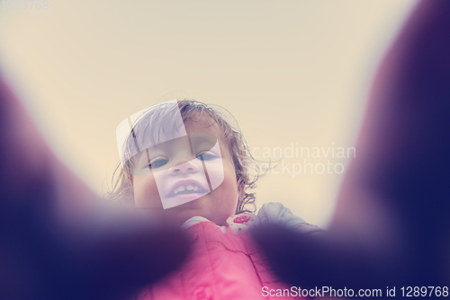 Image of little girl spending time at backyard