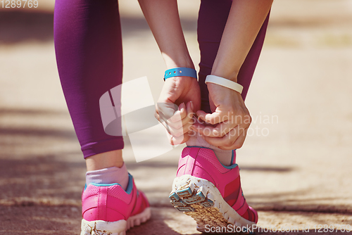 Image of young female runner training for marathon