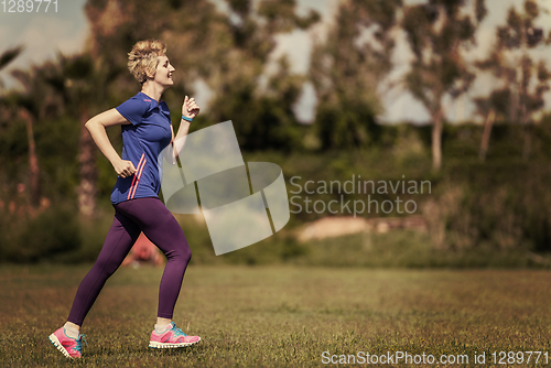 Image of young female runner training for marathon