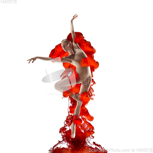 Image of Creative collage formed by color dissolving in water with ballet dancer