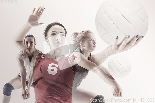 Image of Young female volleyball player isolated on white studio background