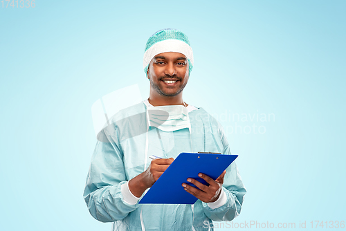 Image of indian male doctor or surgeon with clipboard