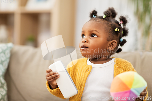 Image of african american baby girl with smartphone at home