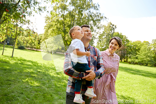 Image of happy family at summer park