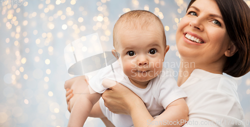 Image of happy middle-aged mother with little baby daughter