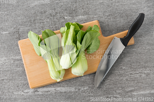 Image of bok choy cabbage and knife on cutting board