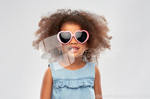 Image of little african girl in heart shaped sunglasses