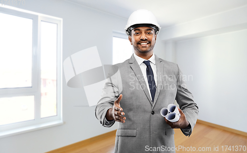 Image of male architect in helmet giving hand for handshake