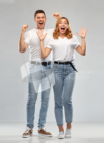 Image of portrait of happy couple in white t-shirts