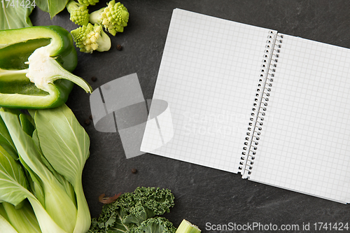 Image of green vegetables and diary with empty pages