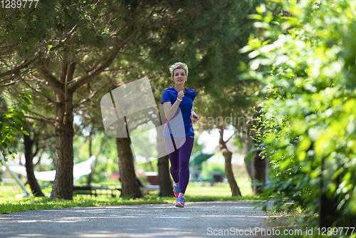 Image of young female runner training for marathon