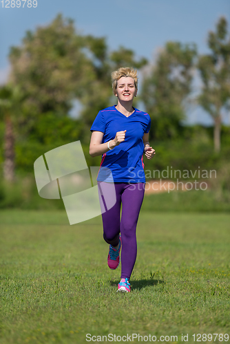 Image of young female runner training for marathon