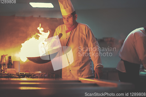 Image of Chef doing flambe on food