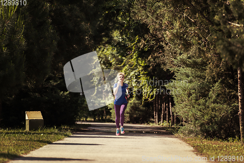 Image of young female runner training for marathon