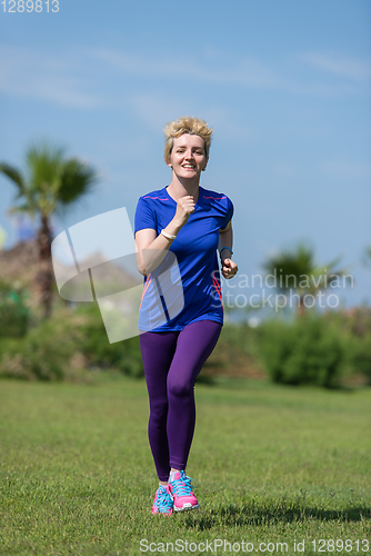 Image of young female runner training for marathon