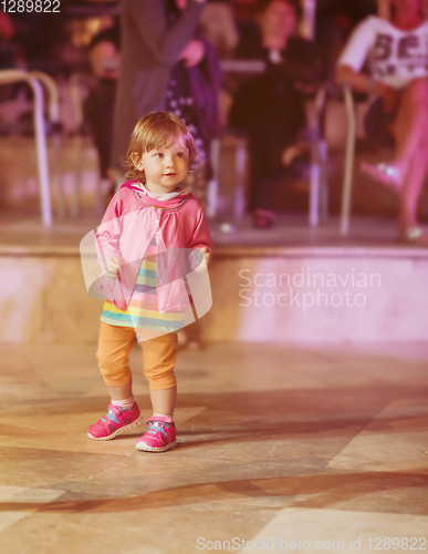 Image of little girl dancing in the kids disco