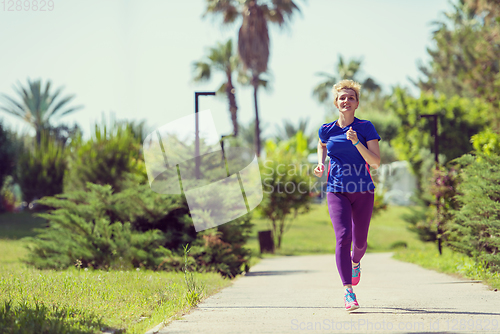 Image of young female runner training for marathon