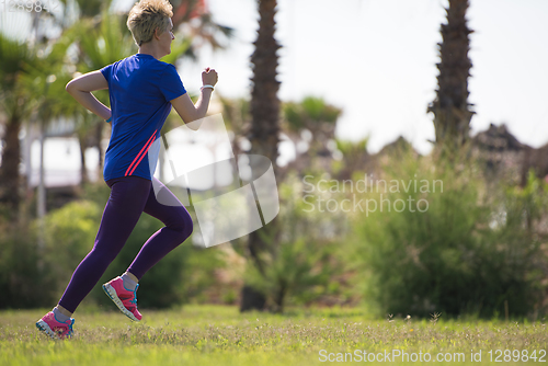 Image of young female runner training for marathon