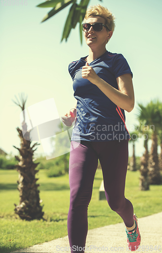 Image of young female runner training for marathon