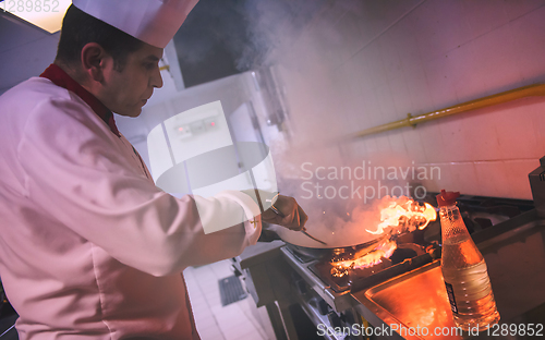 Image of Chef doing flambe on food