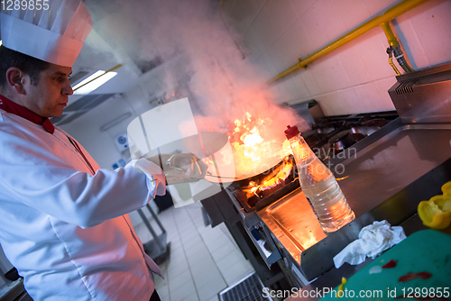 Image of Chef doing flambe on food