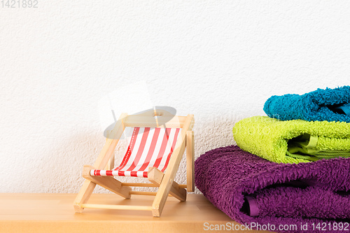 Image of sunlounger and towels background