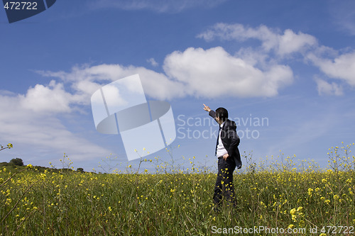 Image of businessman pointing outdoor