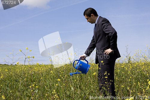 Image of businessman with a flowerpot