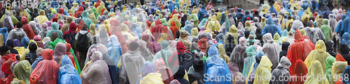 Image of Crowd in colorful raincoats