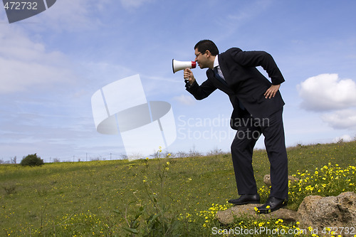 Image of Businessman speaking with a megaphone