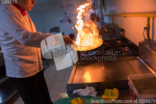 Image of Chef doing flambe on food