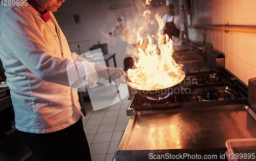 Image of Chef doing flambe on food