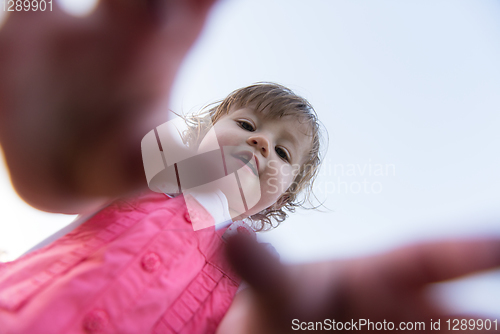 Image of little girl spending time at backyard