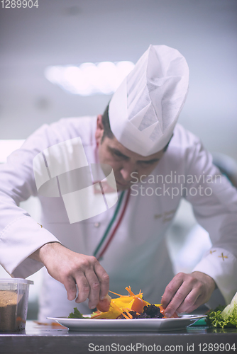 Image of chef serving vegetable salad
